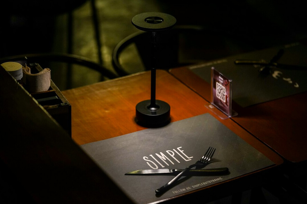 Reporter taking notes with a notebook and recorder on a table